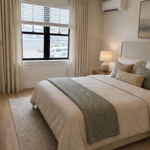 a bedroom with a large window