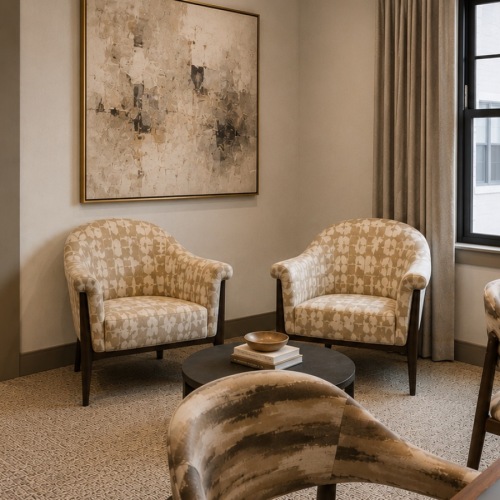 room with chairs and painting on the wall